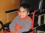 A happy wheelchair recipient